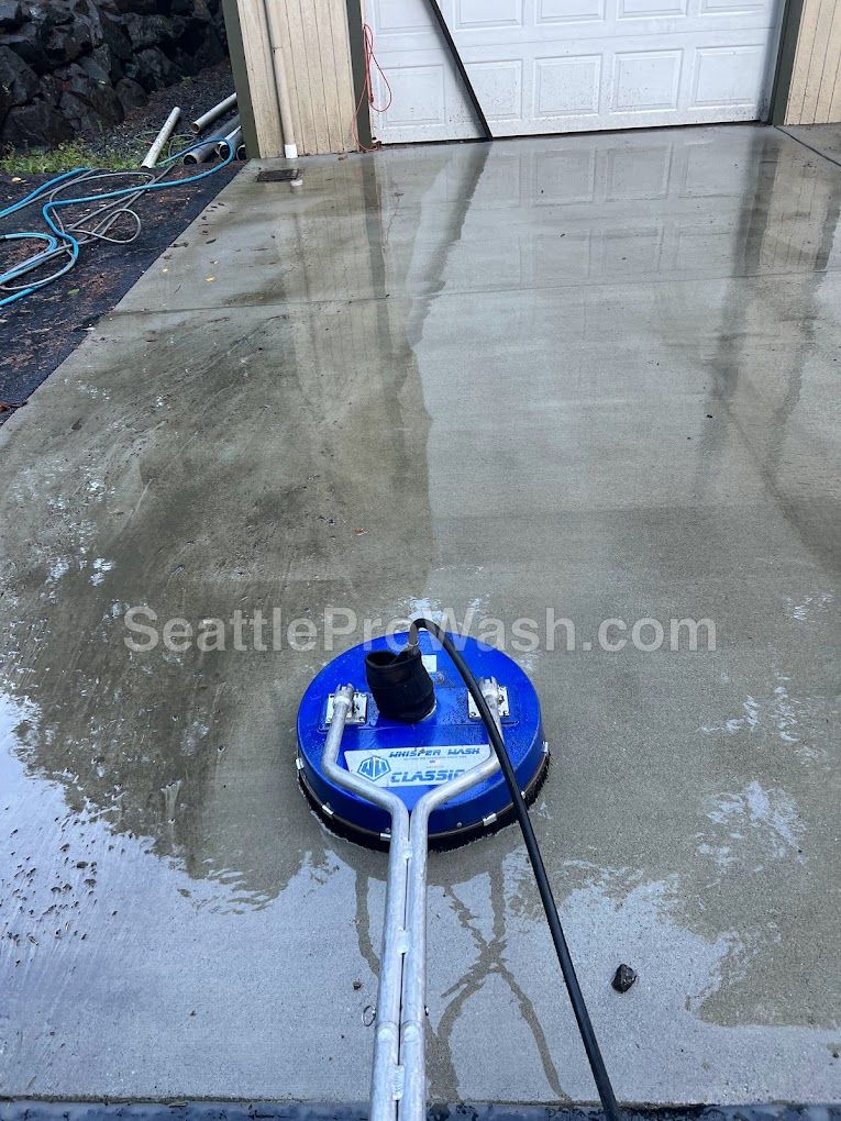 Surface cleaner washing a concrete driveway
