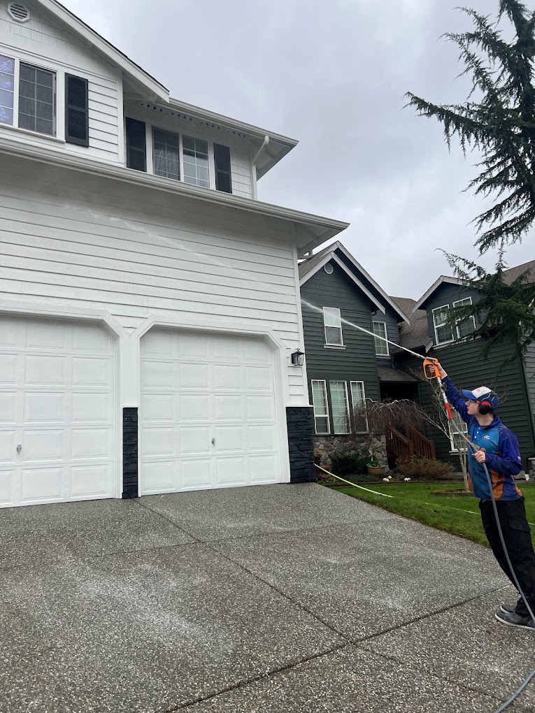 Seattle ProWash technician performing professional house soft washing in Kenmore